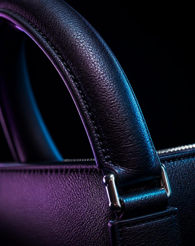 Reconditioned designer leather handbag handle