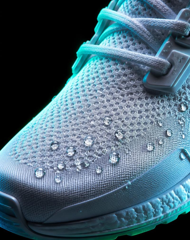 Freshly cleaned white trainer upper with water droplets